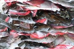 Painted crumpled pieces of paper on the surface of a rough wall. Red black tones stock images Painted crumpled pieces of paper on the surface of a rough wall. Red black tones stock images