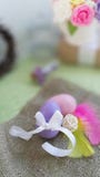 Painted egg with bowknot, colorful feathers on burlap fabric background. royalty free stock photos Painted egg with bowknot, colorful feathers on burlap fabric background. royalty free stock photos