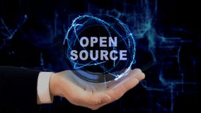 Painted hand shows concept hologram Open source on his hand stock images Painted hand shows concept hologram Open source on his hand stock images