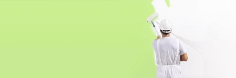 Painter Man At Work With A Paint Roller, Wall Painting Green Col Royalty Free Stock Photos Painter Man At Work With A Paint Roller, Wall Painting Green Col Royalty Free Stock Photos