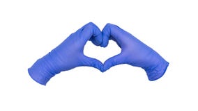 Pair of hands wearing blue nitrile examination gloves come together to make a heart or love gesture