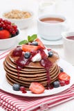 Pancakes With Cream, Fruit Sauce And Berries For Breakfast Royalty Free Stock Photos