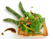 Panfried Salmon With Asparagus And Salad Stock Photo