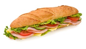 Panino di sottomarino del prosciutto & del formaggio del Footlong fotografia stock libera da diritti Panino di sottomarino del prosciutto & del formaggio del Footlong fotografia stock libera da diritti