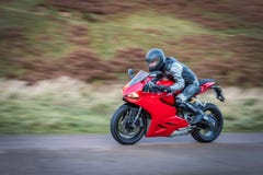 Panning Motorbike At Speed Royalty Free Stock Image