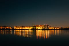 Panorama of city buildings lights reflection in water at night sky background, minimalism urban style. Royalty Free Stock Image Panorama of city buildings lights reflection in water at night sky background, minimalism urban style. Royalty Free Stock Image