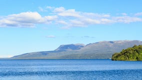 Panorama of Lake Tarawera, New Zealand, with Mount Tarawera in the background stock image Panorama of Lake Tarawera, New Zealand, with Mount Tarawera in the background stock image