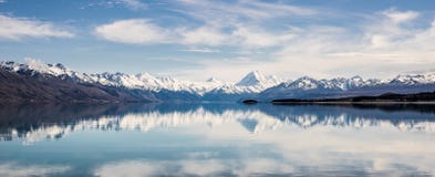 Panorama of New Zealand snow mountain reflect on turquoise lake stock photo Panorama of New Zealand snow mountain reflect on turquoise lake stock photo
