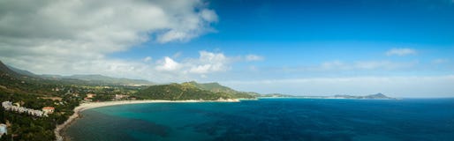 Panoramic Aerial View To Sandy Beach Of Mediterranean Sea With Hills And Mountains At Background. Sardinia, Italy Stock Images Panoramic Aerial View To Sandy Beach Of Mediterranean Sea With Hills And Mountains At Background. Sardinia, Italy Stock Images