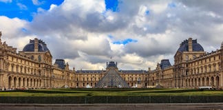 Panoramic view of the facade of the famous Louvre Museum, one of the world`s largest art museums and a historic monument in Paris stock images Panoramic view of the facade of the famous Louvre Museum, one of the world`s largest art museums and a historic monument in Paris stock images