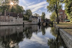 Panoramic view of Minnewater park with beautiful white swans in spring evening in medieval part of Bruges Brugge, Belgium royalty free stock images Panoramic view of Minnewater park with beautiful white swans in spring evening in medieval part of Bruges Brugge, Belgium royalty free stock images