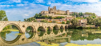 Panoramic view at the Old Bridge over Orb river with Cathedral of Saint Nazaire in Beziers - France Stock Photos Panoramic view at the Old Bridge over Orb river with Cathedral of Saint Nazaire in Beziers - France Stock Photos