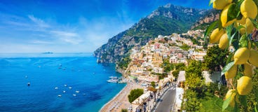 Panoramic view of Positano with comfortable beaches and blue sea on Amalfi Coast in Campania, Italy. Amalfi coast is popular