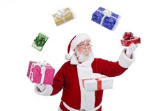 Papai Noel que joga e que joga com presentes fotografia de stock royalty free Papai Noel que joga e que joga com presentes fotografia de stock royalty free