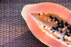 Papaya Carica papaya is an exotic, tasty, sweet fruit. Fruit of melon bread tree. Papaya seeds are edible and can be a cure. stock images Papaya Carica papaya is an exotic, tasty, sweet fruit. Fruit of melon bread tree. Papaya seeds are edible and can be a cure. stock images