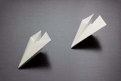 Paper air plane on dark background for design stock images Paper air plane on dark background for design stock images