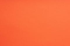 Paper background coral color. Rough paper texture. Closeup. Macro stock image Paper background coral color. Rough paper texture. Closeup. Macro stock image