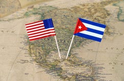 The United States of America and Cuba flag pins on a world map, political relations concept Stock Images The United States of America and Cuba flag pins on a world map, political relations concept Stock Images