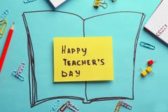 Paper with inscription HAPPY TEACHER`S DAY