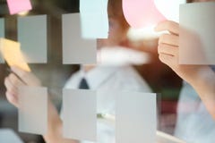 Paper note on window with a hands selected a paper sticky note. stock images Paper note on window with a hands selected a paper sticky note. stock images
