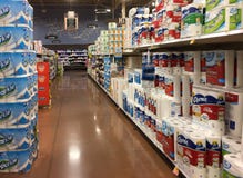 Paper towels on shelves for sale at grocery store