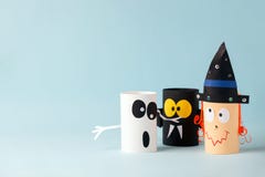 Paper Toy Ghost, Bat, Witch For Halloween Party. Easy Crafts For Kids On Blue Background, Copy Space, Die Creative Idea From Royalty Free Stock Photo Paper Toy Ghost, Bat, Witch For Halloween Party. Easy Crafts For Kids On Blue Background, Copy Space, Die Creative Idea From Royalty Free Stock Photo