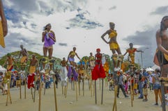 A parade of Moko-Jumbies or Stiltwakers at the Queen`s Park Savannah in Port-of-Spain