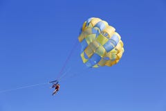 Parasailing in a blue sky in Punta Cana, Dominican Republic stock photo Parasailing in a blue sky in Punta Cana, Dominican Republic stock photo