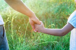 Parent holds the hand of a small child royalty free stock photo Parent holds the hand of a small child royalty free stock photo