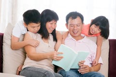 Parents and children reading books at home. royalty free stock photo Parents and children reading books at home. royalty free stock photo