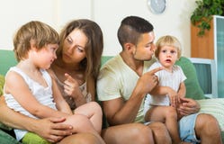Parents scolding children in home stock images Parents scolding children in home stock images