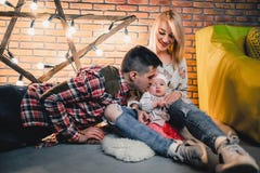 parents with their child on the background of a star with bulbs stock photos parents with their child on the background of a star with bulbs stock photos