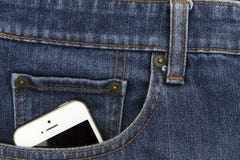Part of mobile white cellphone in the front pocket of blue denim. Jeans Royalty Free Stock Photos Part of mobile white cellphone in the front pocket of blue denim. Jeans Royalty Free Stock Photos