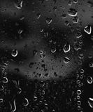 Part of series. Background photo of rain drops on dark glass, different size: small medium and large, horizontal view royalty free illustration Part of series. Background photo of rain drops on dark glass, different size: small medium and large, horizontal view royalty free illustration