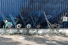 Parters` hand carts standing next to a dark blue fence in Venice, Italy royalty free stock photos Parters` hand carts standing next to a dark blue fence in Venice, Italy royalty free stock photos