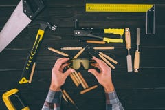 partial view of carpenter holding goggles in hands with various industrial tools around royalty free stock images partial view of carpenter holding goggles in hands with various industrial tools around royalty free stock images