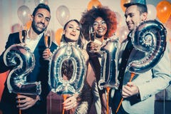 Party people women and men celebrating new years eve 2019 royalty free stock photography Party people women and men celebrating new years eve 2019 royalty free stock photography