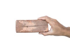 Passi la tenuta del decadimento vecchio mattone scarsa qualità, isolato su fondo bianco Fotografia Stock Passi la tenuta del decadimento vecchio mattone scarsa qualità, isolato su fondo bianco Fotografia Stock