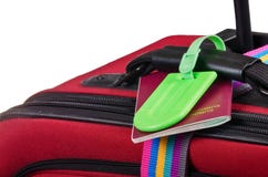 Passport and luggage tag on suitcase stock photos Passport and luggage tag on suitcase stock photos