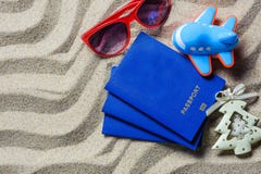 Passport lying on beach sand near the plane stock images Passport lying on beach sand near the plane stock images