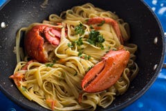 Pasta with american Lobster in pan Royalty Free Stock Images Pasta with american Lobster in pan Royalty Free Stock Images