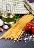 Pasta ingredients on black background. Stock Photos Pasta ingredients on black background. Stock Photos
