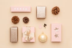 Pastel pink and gold minimal christmas background. Beautiful nordic christmas gifts isolated on beige background. Pink gift boxes. stock images Pastel pink and gold minimal christmas background. Beautiful nordic christmas gifts isolated on beige background. Pink gift boxes. stock images