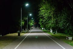 Path Through City Park At Night With Street Lamps Royalty Free Stock Photos