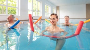 Patients during remobilization in a health center doing aquarobics stock image Patients during remobilization in a health center doing aquarobics stock image