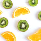 Pattern with oranges and kiwi slices on a white wooden background. The basis for the booklet, the background for the banner. Basis royalty free stock photos Pattern with oranges and kiwi slices on a white wooden background. The basis for the booklet, the background for the banner. Basis royalty free stock photos