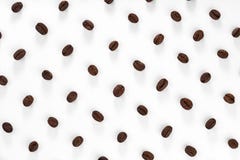 A pattern of roasted coffee beans placed in diagonal rows on a white background stock images A pattern of roasted coffee beans placed in diagonal rows on a white background stock images