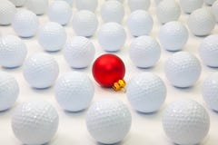 Pattern with white golf balls and red Christmas decoration