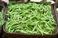 Pea or string bean in a basket on sale in supermarket stock photo Pea or string bean in a basket on sale in supermarket stock photo