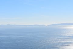A Peaceful Sunny Ocean View With smooth Water and A Clear Blue Sky royalty free stock photography A Peaceful Sunny Ocean View With smooth Water and A Clear Blue Sky royalty free stock photography